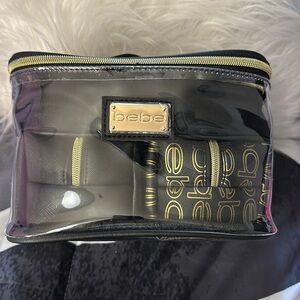 NWT-Bebe 4-in-1 cosmetic bag set with two travel bottles.